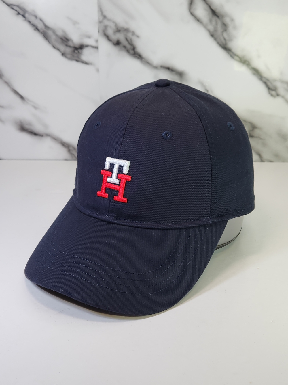 Tommy Hilfiger Navy Hat with Small Red & White Flag Logo. Adjustable